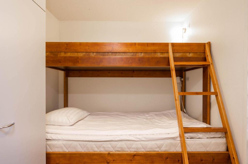 Postel nebo postele na pokoji v ubytování Ski-Inn RukaSuites