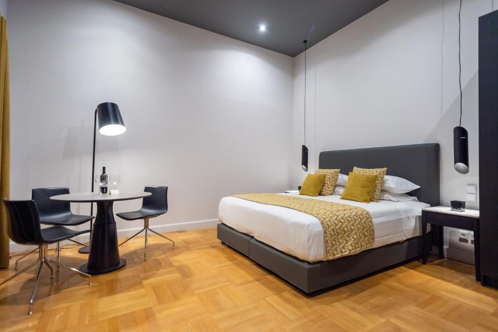 Posteľ alebo postele v izbe v ubytovaní 33SolonosSuites