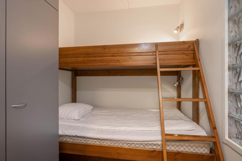 Postel nebo postele na pokoji v ubytování Ski-Inn RukaSuites