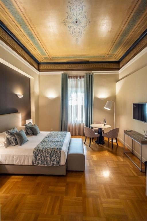 Posteľ alebo postele v izbe v ubytovaní 33SolonosSuites