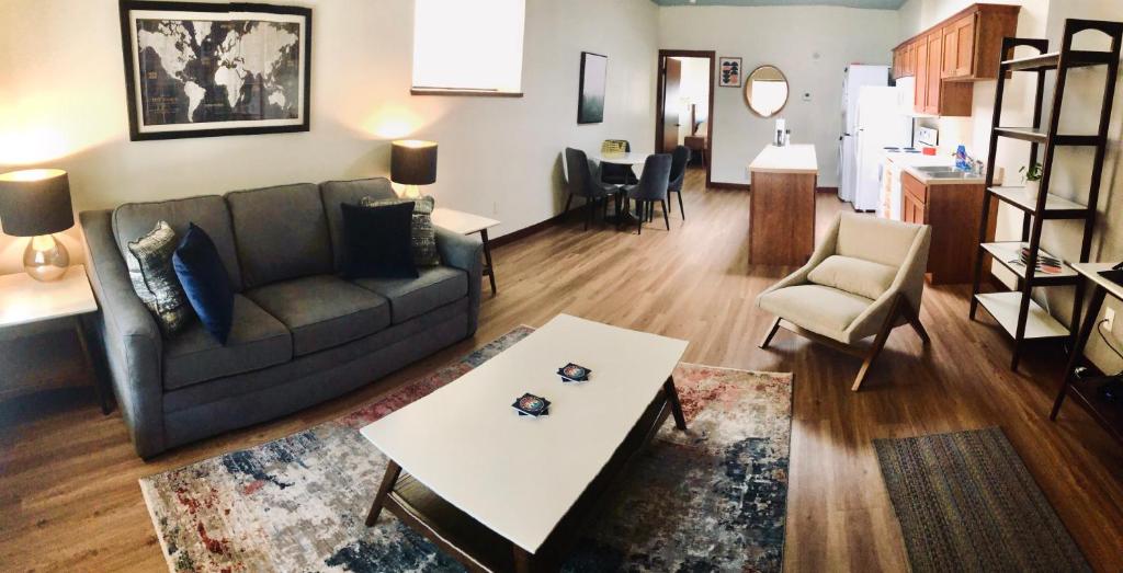 a living room with a couch and a table at Your Downtown Rapid City Base Camp! in Rapid City