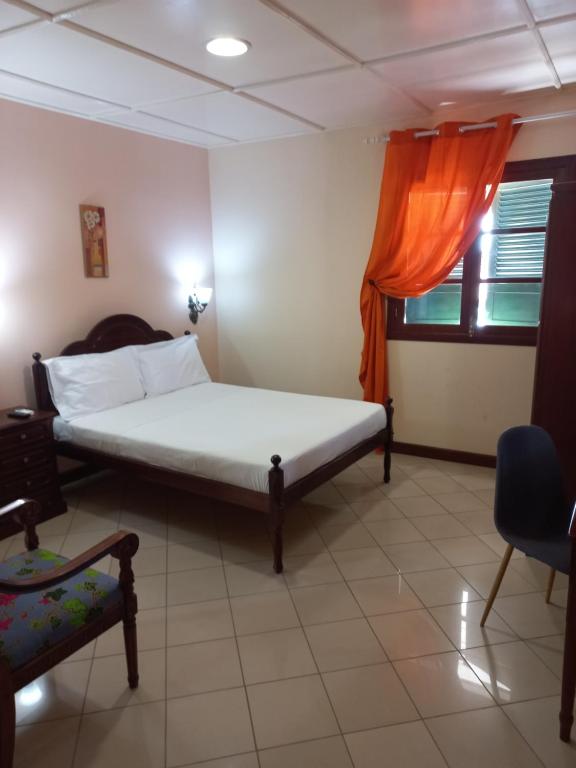 Postel nebo postele na pokoji v ubytování Hotel Savana