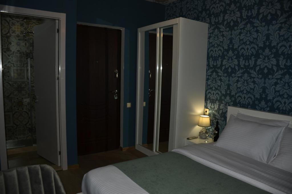 Postel nebo postele na pokoji v ubytování Vere Corner Hotel
