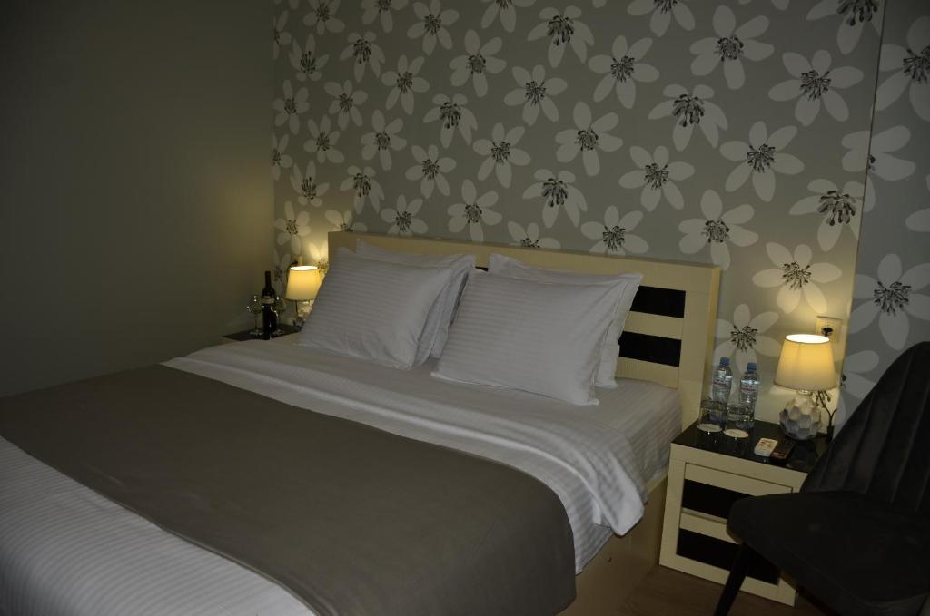 Postel nebo postele na pokoji v ubytování Vere Corner Hotel