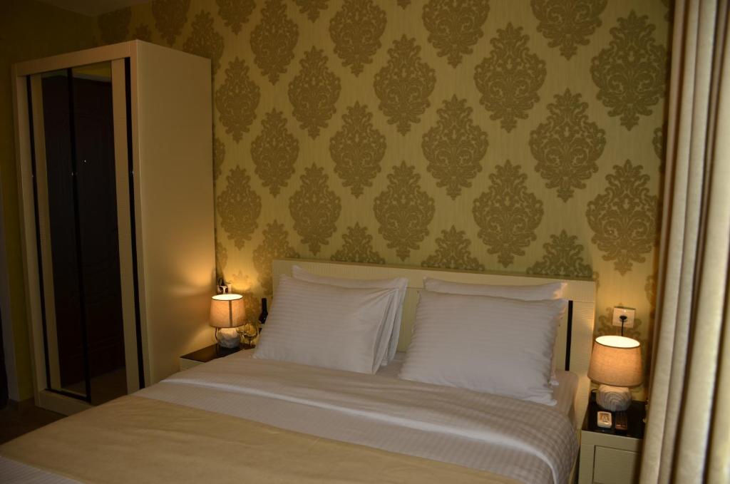 Postel nebo postele na pokoji v ubytování Vere Corner Hotel