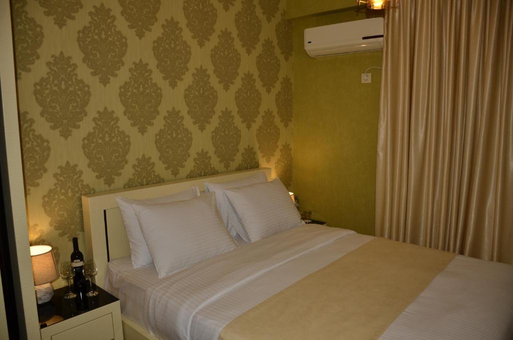 Postel nebo postele na pokoji v ubytování Vere Corner Hotel