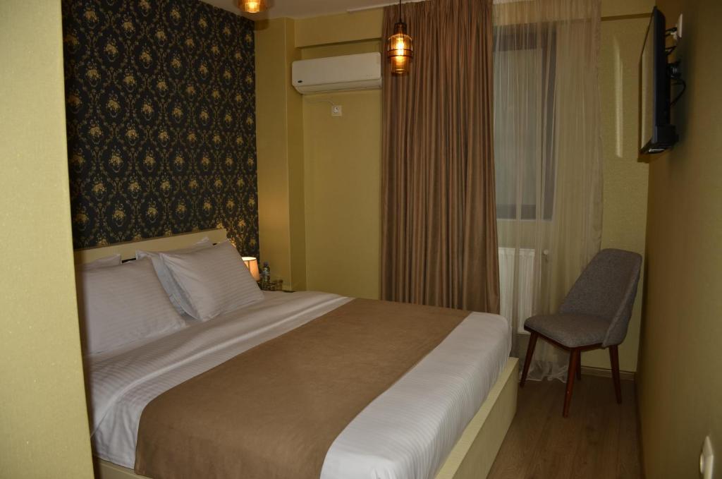 Postel nebo postele na pokoji v ubytování Vere Corner Hotel
