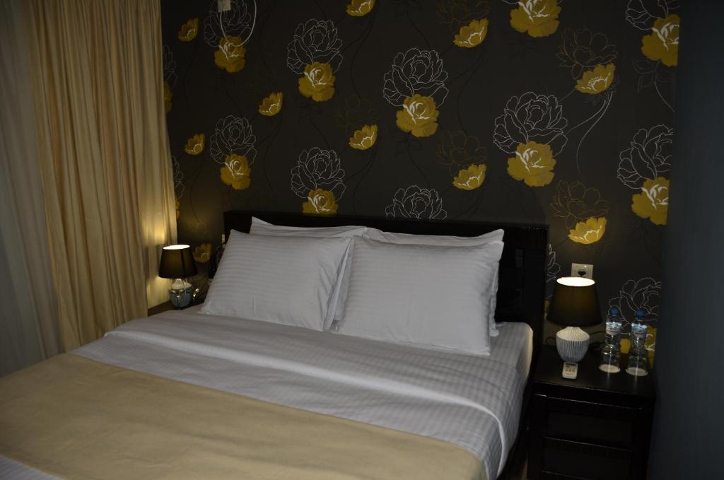 Postel nebo postele na pokoji v ubytování Vere Corner Hotel