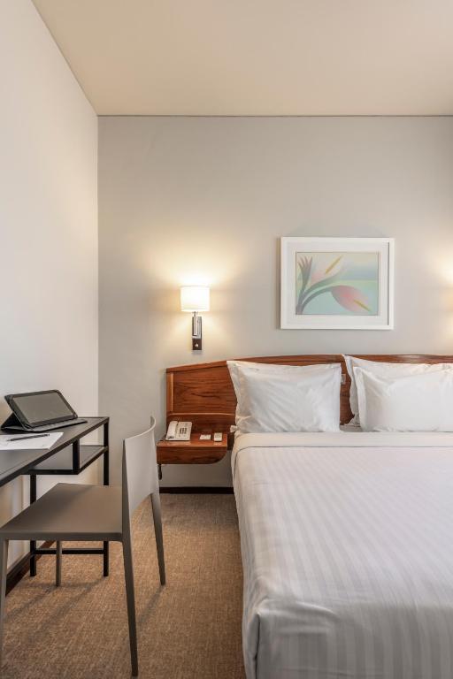 Postel nebo postele na pokoji v ubytování Hotel Dom Carlos Park