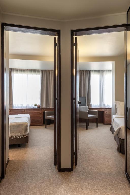 Postel nebo postele na pokoji v ubytování Hotel Dom Carlos Park