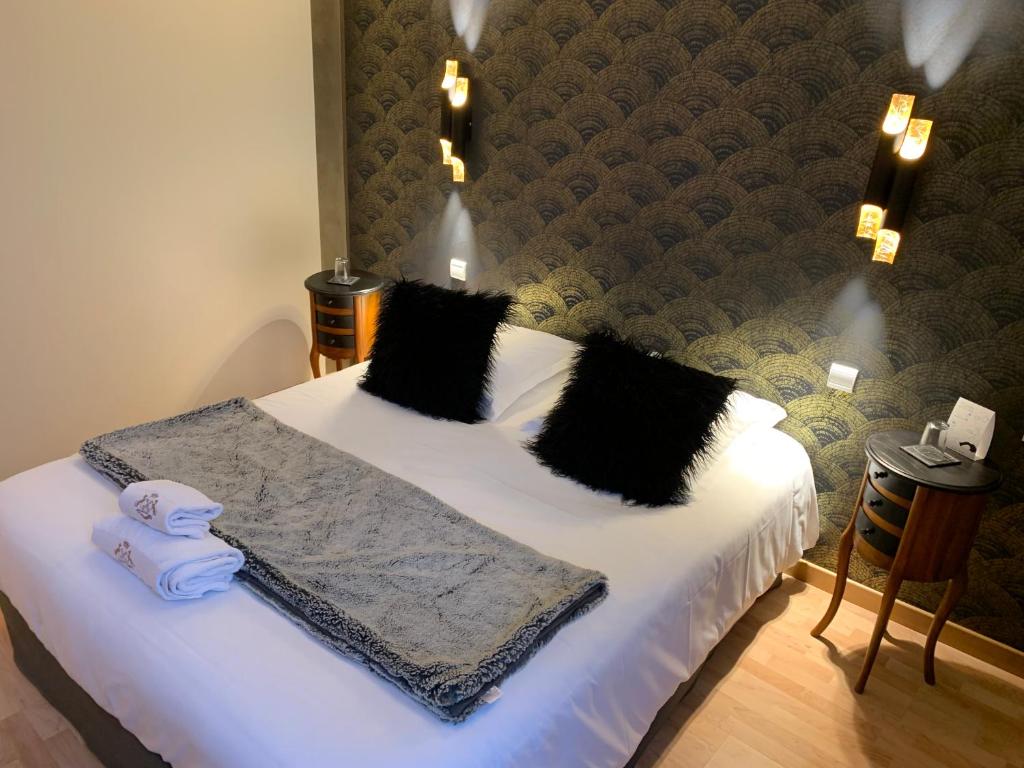 Postel nebo postele na pokoji v ubytování Hôtel Vintage
