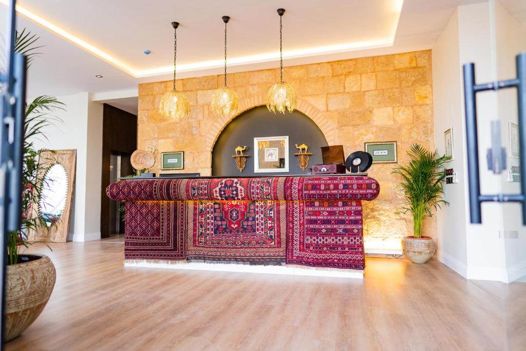 a room with a table with a rug on it at Malfakum Al Diriyah in Riyadh