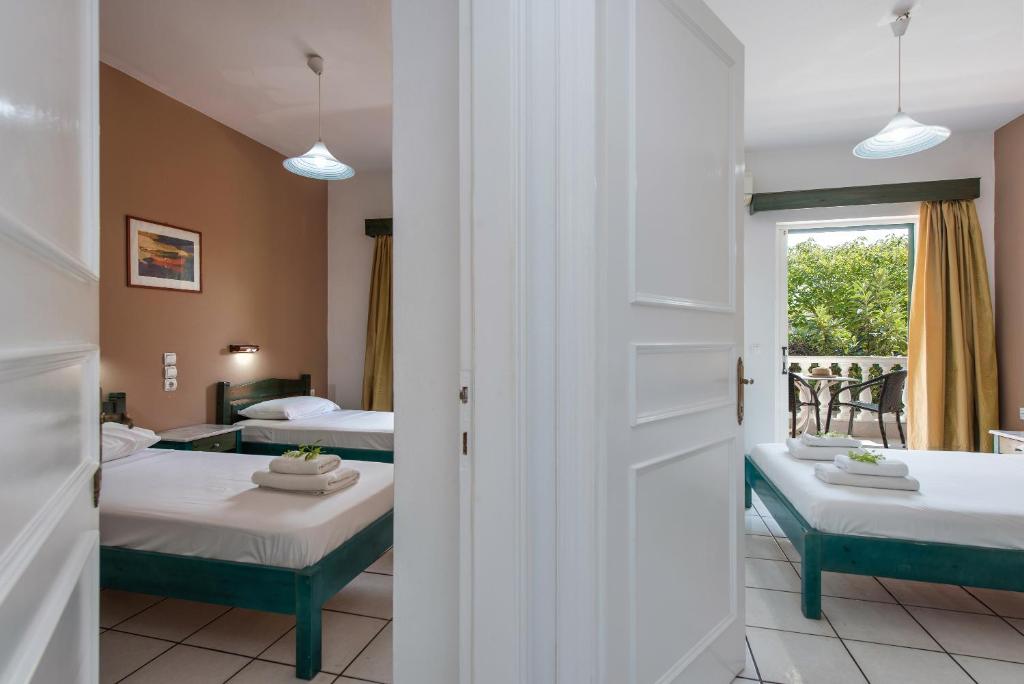 Postel nebo postele na pokoji v ubytování Eriva Hotel