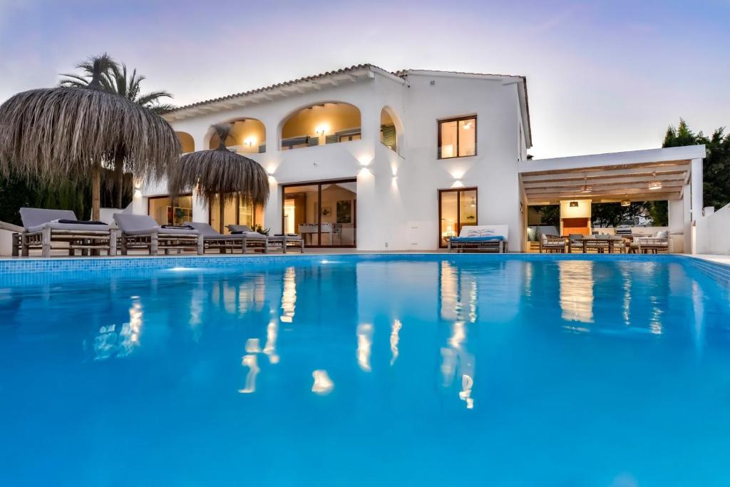 a large swimming pool in front of a house at LA MAR - Managed by Almarina in Benissa