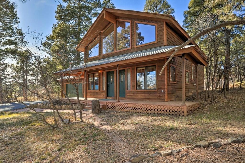 a small wooden house in the woods at Scenic Mountain Hideout with Community Perks! in Pagosa Springs