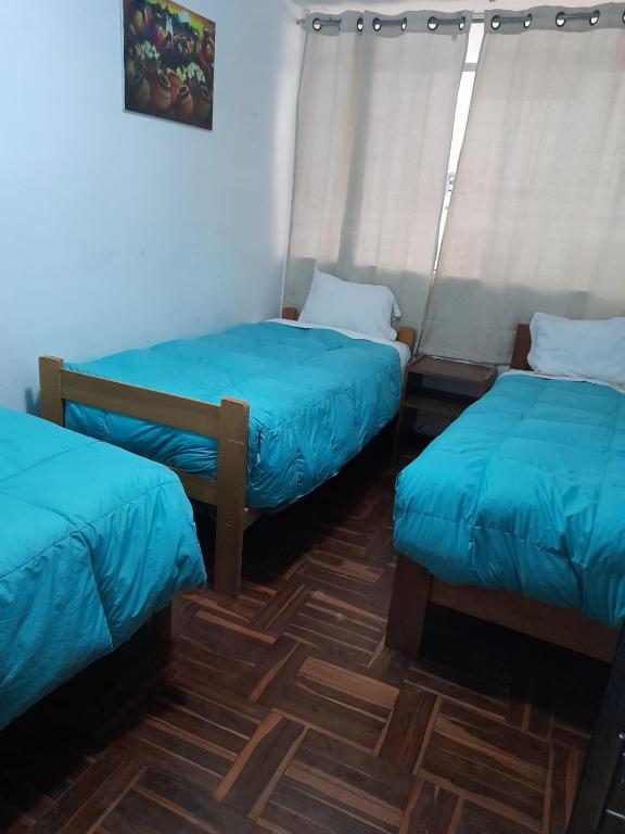 Postel nebo postele na pokoji v ubytování Inka's Rest Hostel