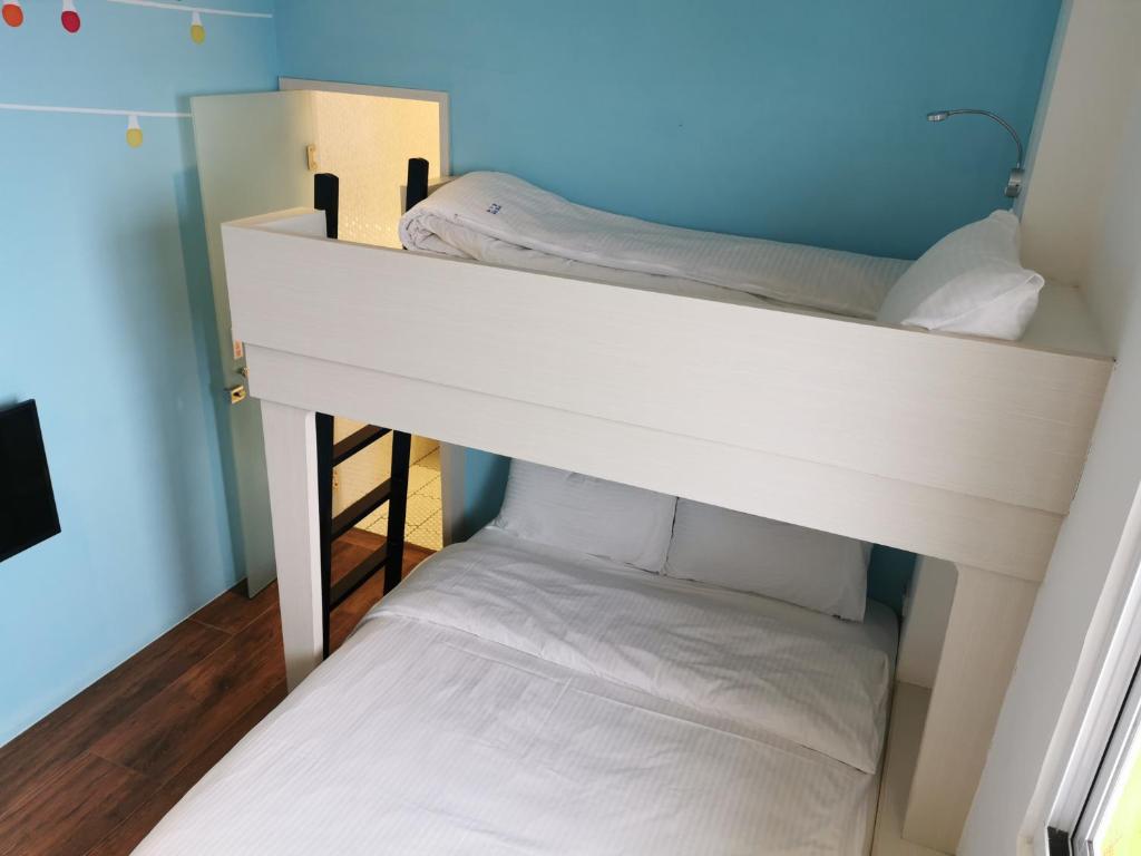Postel nebo postele na pokoji v ubytování A-Li A-Li Homestay