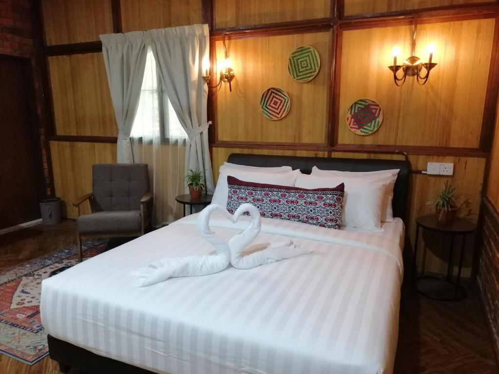 Postel nebo postele na pokoji v ubytování Api-api Eco Chalet