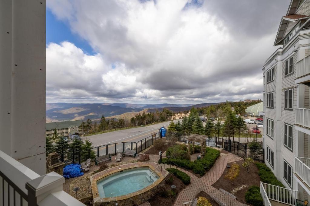 a view from a balcony of a building with a swimming pool at Seneca Unit 102 in Snowshoe