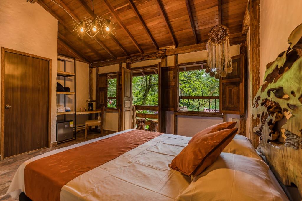 Cama o camas de una habitación en Ecohotel Piedemonte