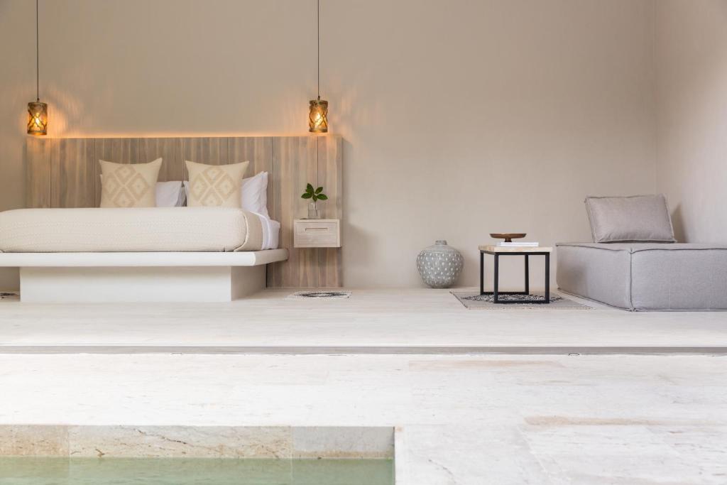 Ein Bett oder Betten in einem Zimmer der Unterkunft Cielo Boutique Hotel & Spa Samui