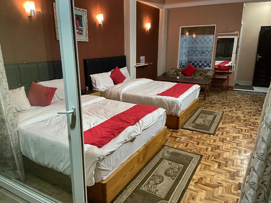 Postel nebo postele na pokoji v ubytování Hidden Gem Residency