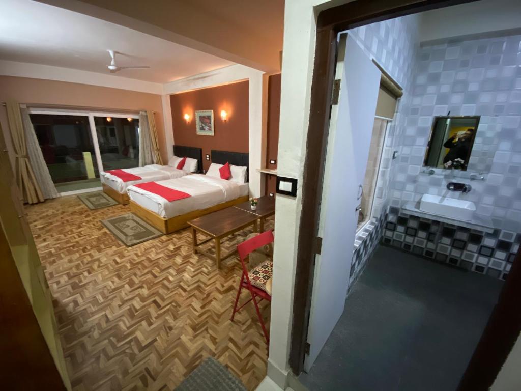 Postel nebo postele na pokoji v ubytování Hidden Gem Residency