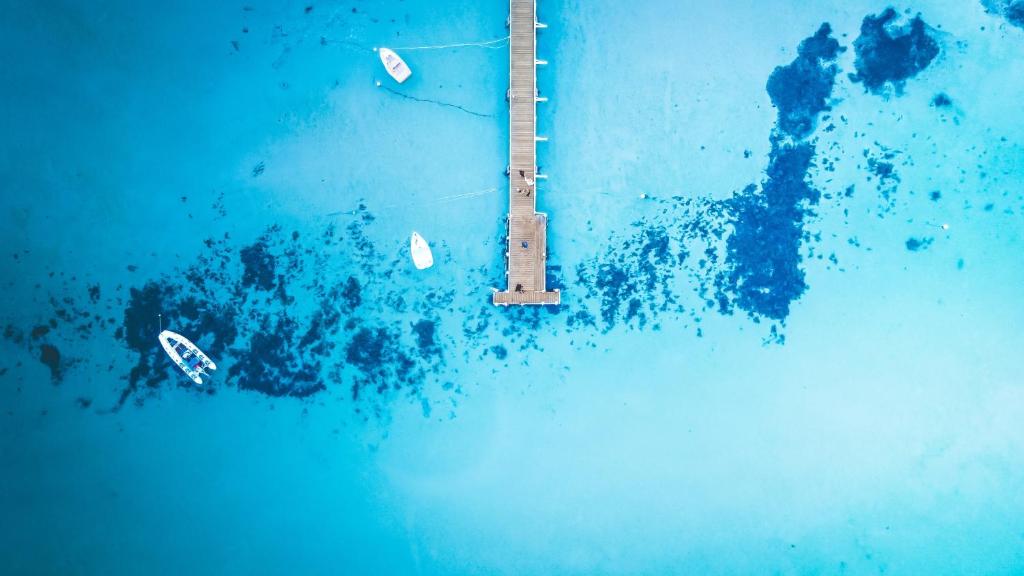 an aerial shot of a boat with a ball in the air at Rye Beach Motel Australia in Rye