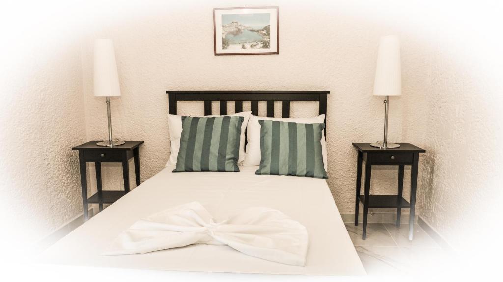 Postel nebo postele na pokoji v ubytování Valentino Hotel