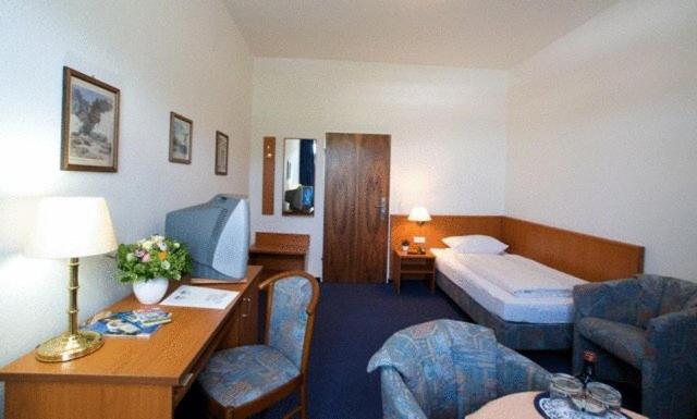 Postel nebo postele na pokoji v ubytování Hotel Haus Reichert
