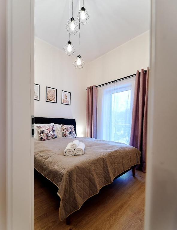 Posteľ alebo postele v izbe v ubytovaní LAGUNA Apartament Polanica Residence 54