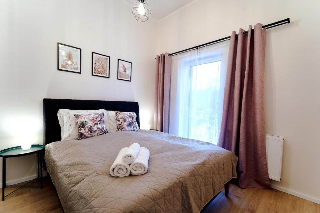 Posteľ alebo postele v izbe v ubytovaní LAGUNA Apartament Polanica Residence 54