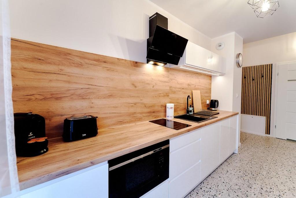 Kuchyňa alebo kuchynka v ubytovaní LAGUNA Apartament Polanica Residence 54