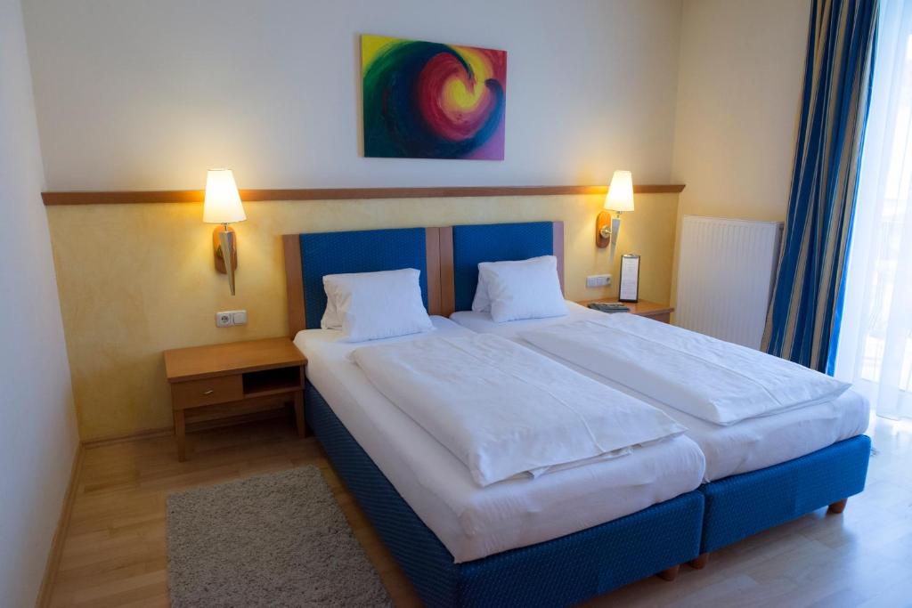 Postel nebo postele na pokoji v ubytování Hotel Locker & Legere