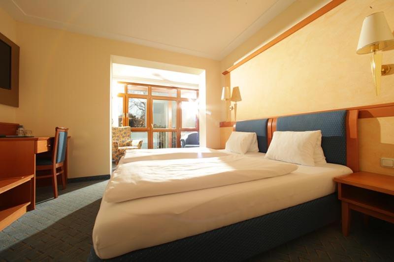 Postel nebo postele na pokoji v ubytování Hotel Locker & Legere