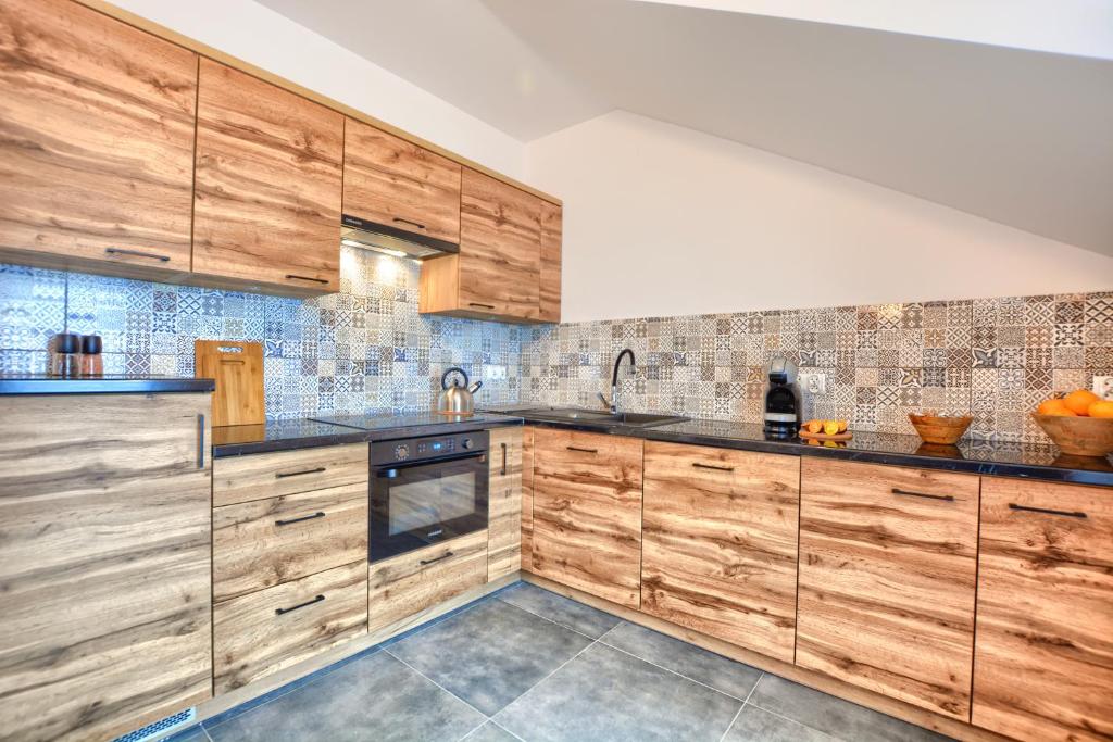 Kuchyňa alebo kuchynka v ubytovaní Apartamenty Maja i Zuzia