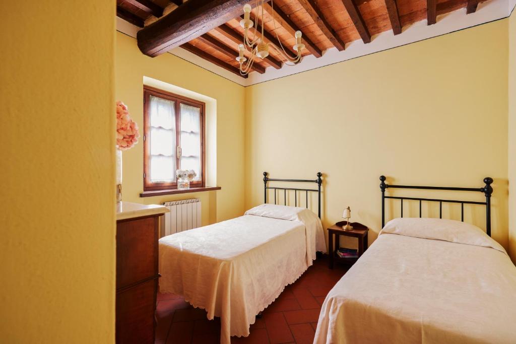 Posteľ alebo postele v izbe v ubytovaní Agriturismo Il Borgo