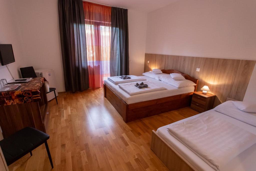 Postel nebo postele na pokoji v ubytování Margaréta Apartman és Üdülőház