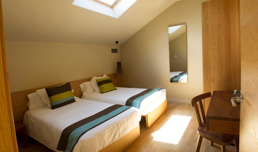 Postel nebo postele na pokoji v ubytování Apartaments Vall de Núria