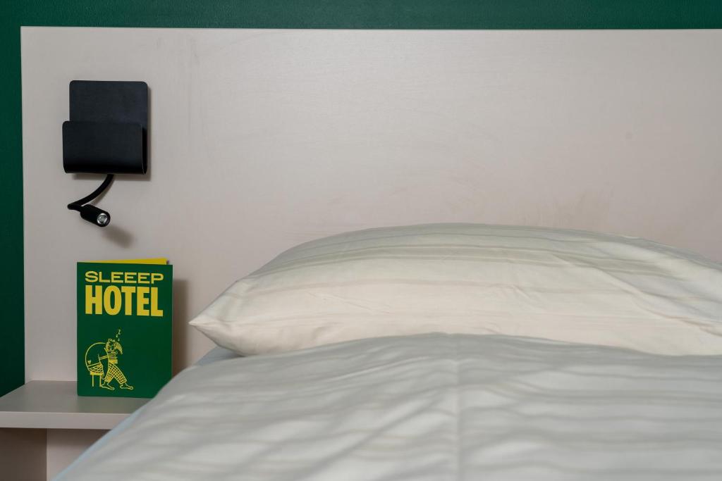 Postel nebo postele na pokoji v ubytování SLEEEP HOTEL Ansfelden