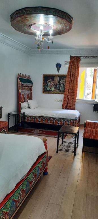 Un ou plusieurs lits dans un hébergement de l'établissement Hotel Moroccan House Casablanca