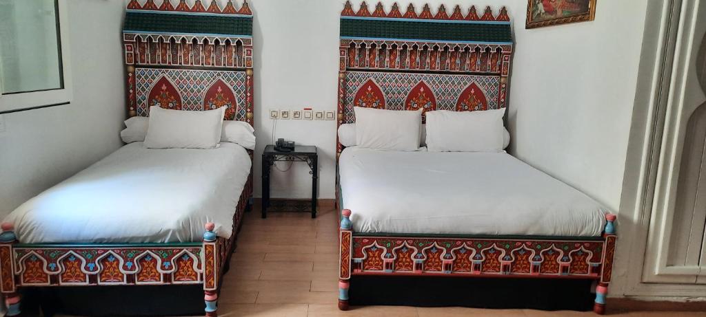 Un ou plusieurs lits dans un hébergement de l'établissement Hotel Moroccan House Casablanca