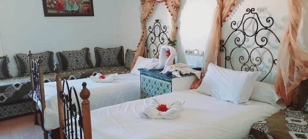 Un ou plusieurs lits dans un hébergement de l'établissement Hotel Moroccan House Casablanca