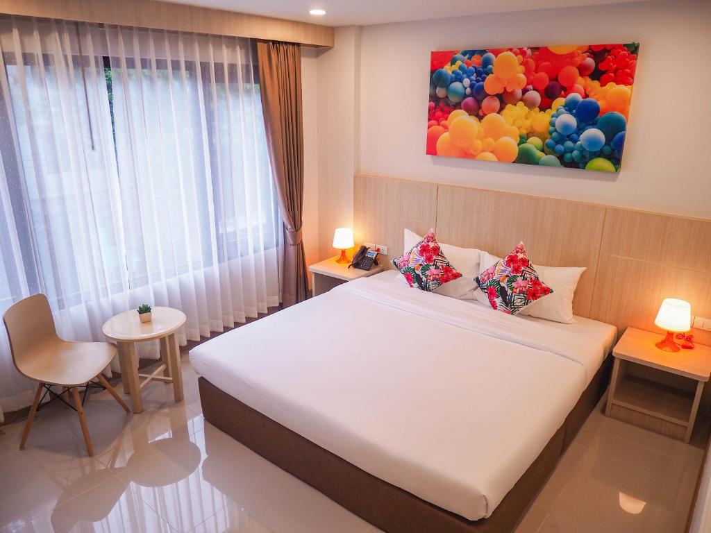 Postel nebo postele na pokoji v ubytování Malee Hotel
