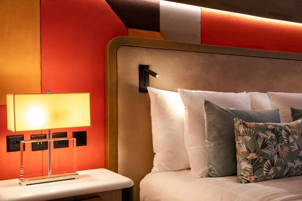 Postel nebo postele na pokoji v ubytování Hotel Bristol