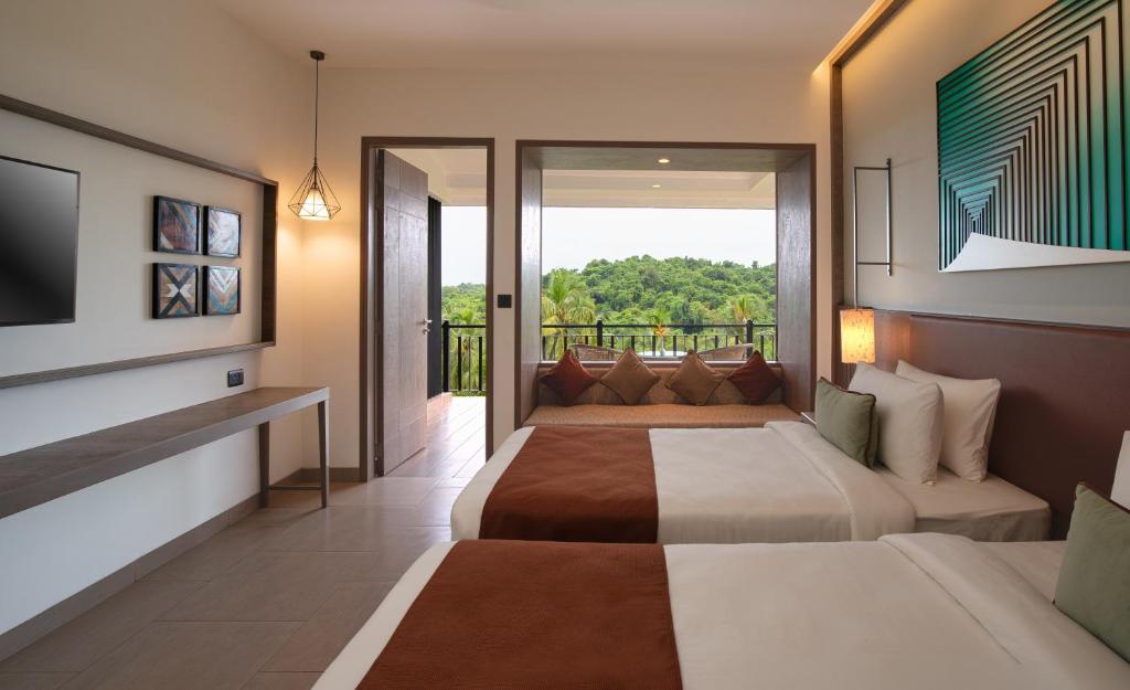 TV a/nebo společenská místnost v ubytování Amoravida By 7 Apple Resorts, Goa