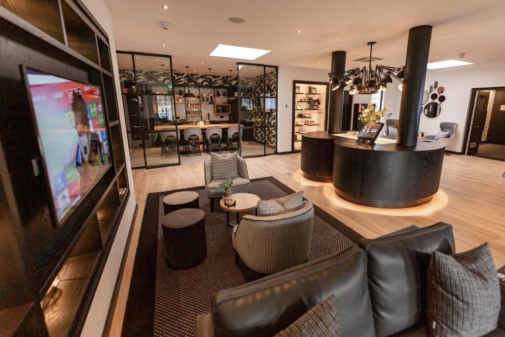 TV a/nebo společenská místnost v ubytování Gr8 Hotel Bodegraven
