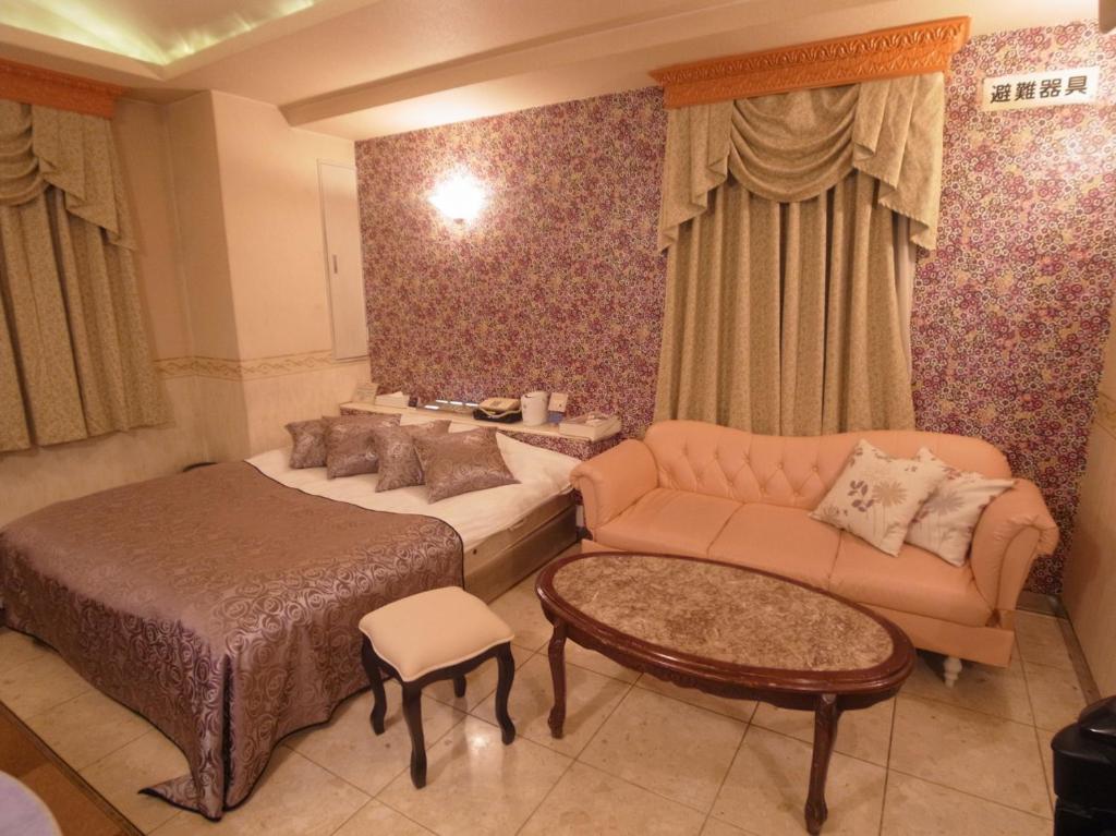 Postel nebo postele na pokoji v ubytování Hotel VINO Adult Only