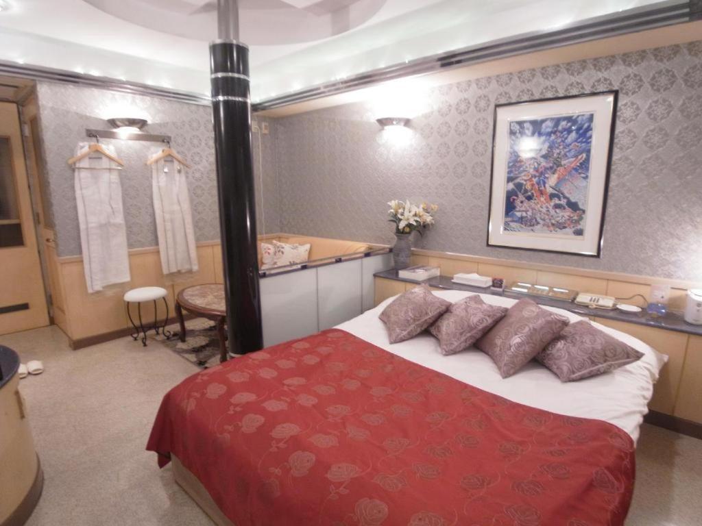 Postel nebo postele na pokoji v ubytování Hotel VINO Adult Only