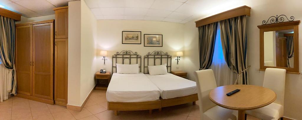 Postel nebo postele na pokoji v ubytování Hotel Kennedy Nova